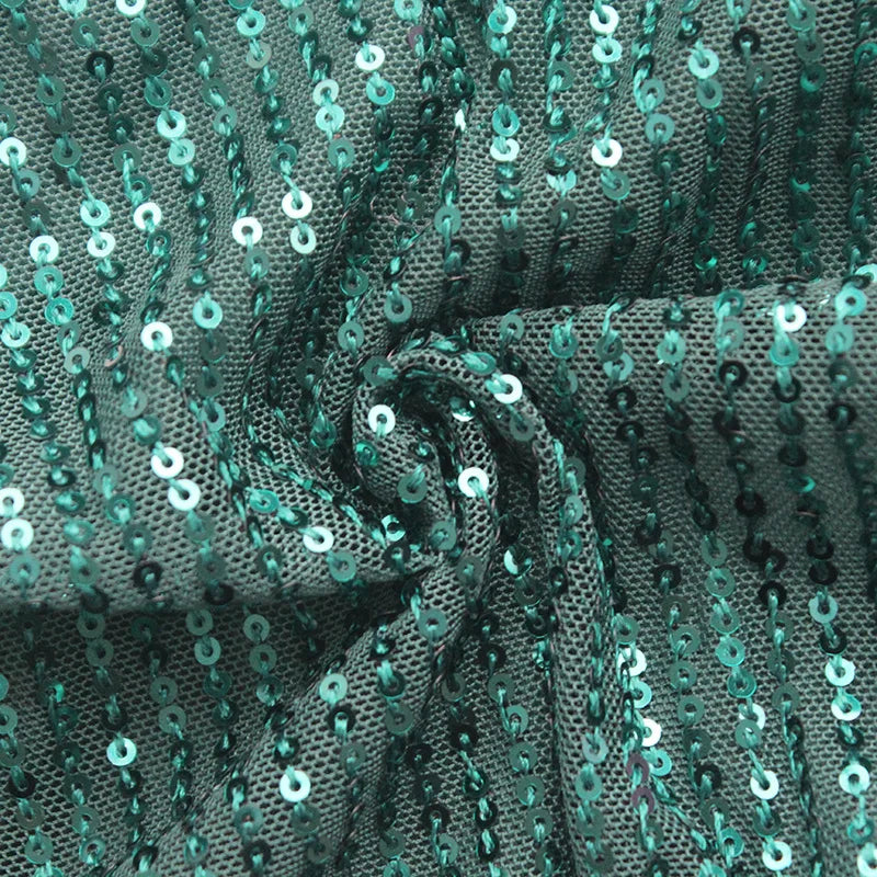 Kleid mit Pailletten, Wickeloptik und Falten
