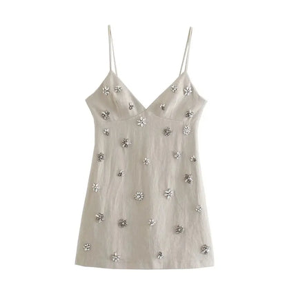 Kurzes beiges Kleid mit Glitzerblumen