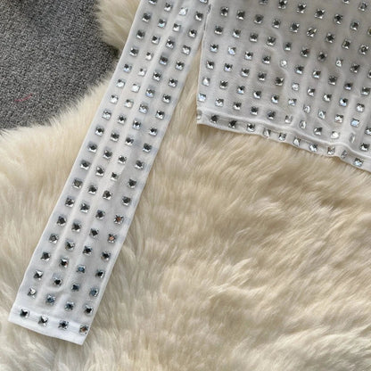 Top mit langen transparenten Strass-Ärmeln